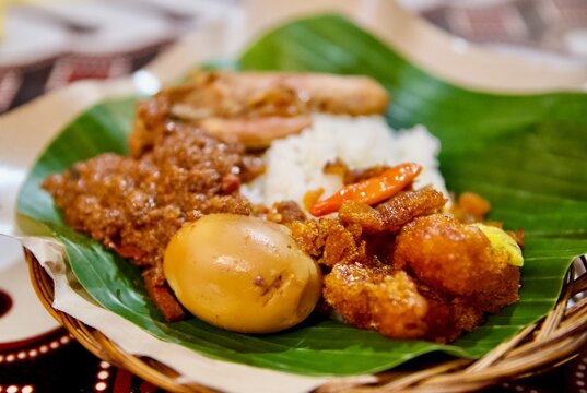 High-angle macro shot of authentic Indonesian gourmet food Gudeg, showcasing rich colors and cultural culinary heritage of Java island.