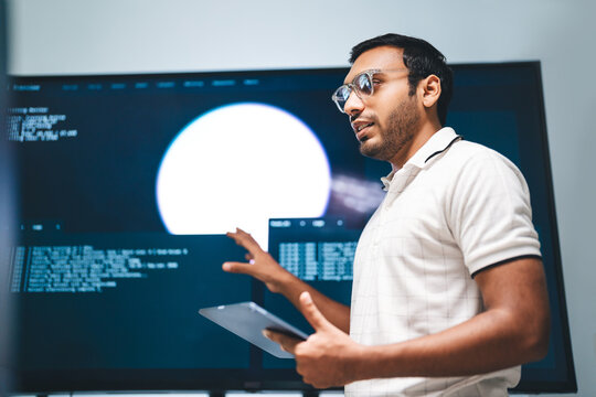 Adult indian engineer programmer presentation coding AI artificial intelligence algorithm coder training monitor developer expertise programming IT technology career