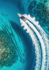 Fototapeta premium Aerial Top View of a Luxury Speedboat Cruising Through Crystal Clear Turquoise Ocean Water Over Coral Reefs