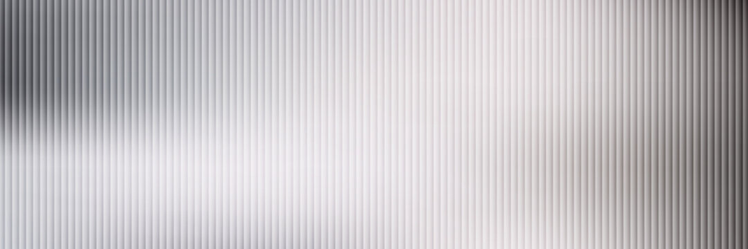 Acrylic satin corrugated glass texture light gray background. Blurred soft ribbed transparent striped door window overlay. Metal silver reeded polycarbonate sheet. Abstract vertical gradient pattern