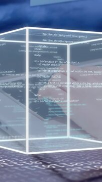 Vertical video: Right hand typing starting holo-cube growing rotating while code scrolling for demo