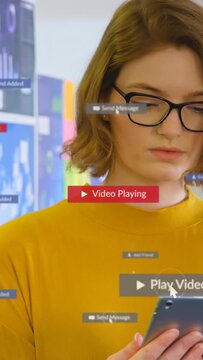 Vertical video: Woman with tablet cursor tapping play creating play badges msg tags for marketing