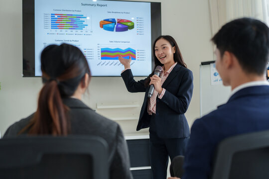 Businesswoman presenting sales report during office meeting