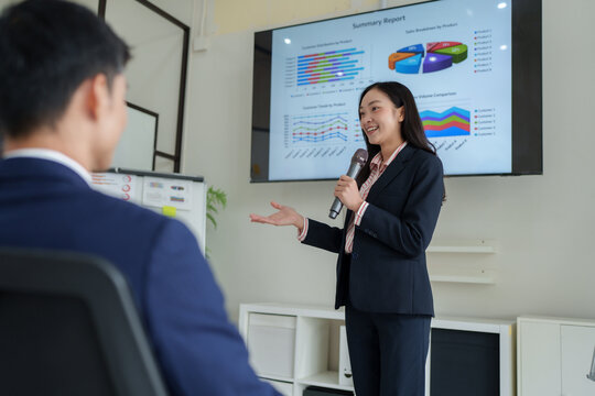 Businesswoman presenting data report during corporate meeting