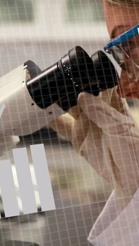 Vertical video: Gloved hand adjusting scope lens, lab scientist peering, analyzing chart UI overlay