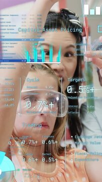 Vertical video: Student holding tube as mentor using pipet and adding green liquid for science HUD