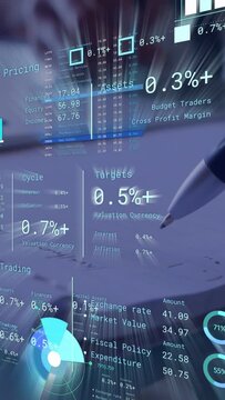 Vertical video: Finance analyst hand pen tip nearing paper tapping tracing updating HUD charts