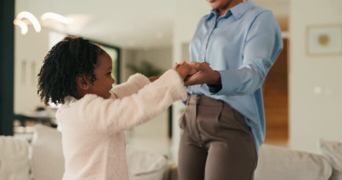 Mother, child and holding hands in living room with dance, trust and bonding together for weekend break. Mom, young daughter smile and play in home with rhythm, music or support for family connection