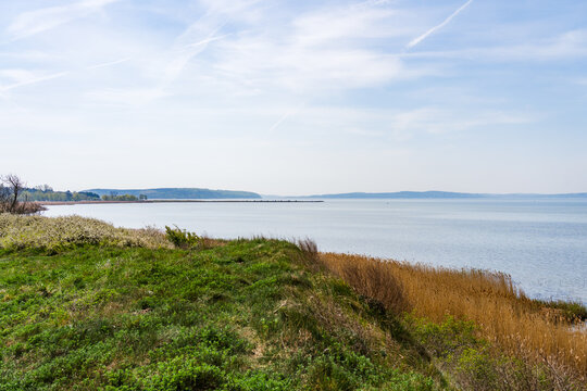 View of the Great Jasmund Bodden toward Martinshafen Mole on a Sunny Spring Day