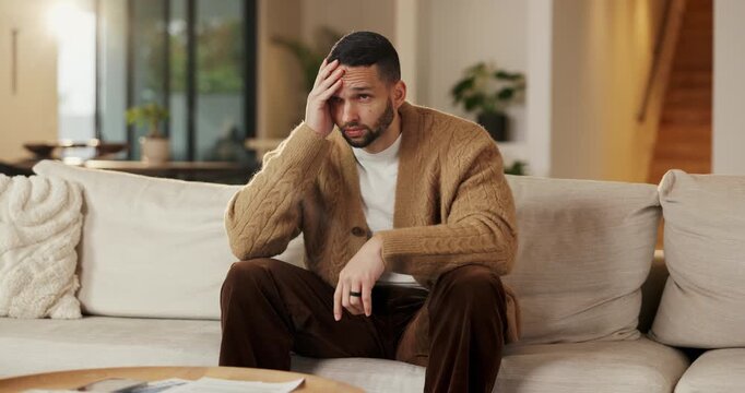 Stress, thinking and man in home on sofa with financial challenge, debt crisis or worry for future. Bankruptcy, reflection and person in living room with investment mistake, fail and regret loss