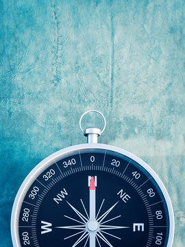 Compass on blue background