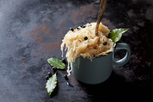 Cup of Sauerkraut with uniper berris and bay leaves