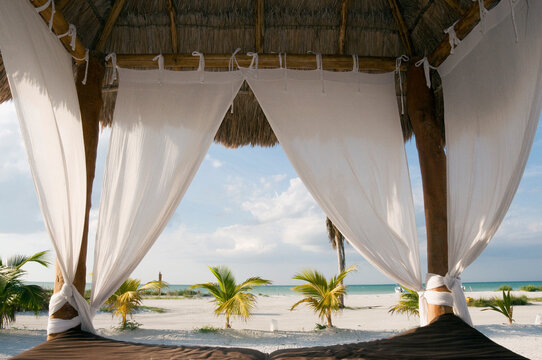 Mexico, Holbox Island, Canopy bed on beach, close-up