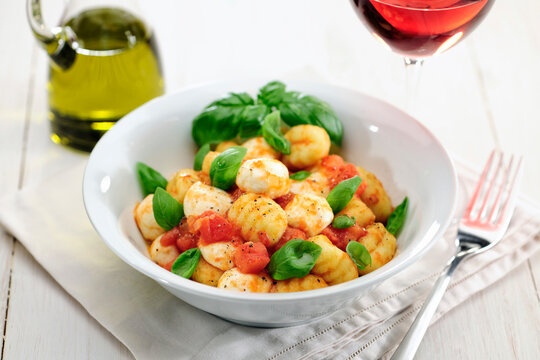 Gnocchi alla Sorrentina, Gnocchi with tomato sauce and mozzarella balls and basil