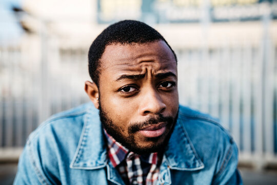 Portrait of sceptical young man