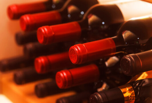 Shelf with red wine bottles