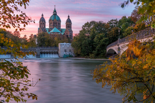 Germany, Bavaria, Munich, River Isar, Prater Island and St Luke's church in autumn