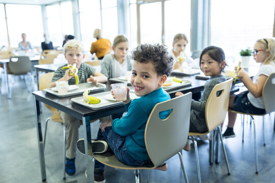 Students enjoying their midday meal in the school cafeteria