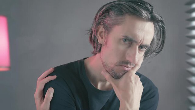 Thinker reflection thinking Close-up of a man in deep thought and introspection showing subtle emotional turmoil hand on face and shoulder shifting from pained to serious expressions neutral lighting