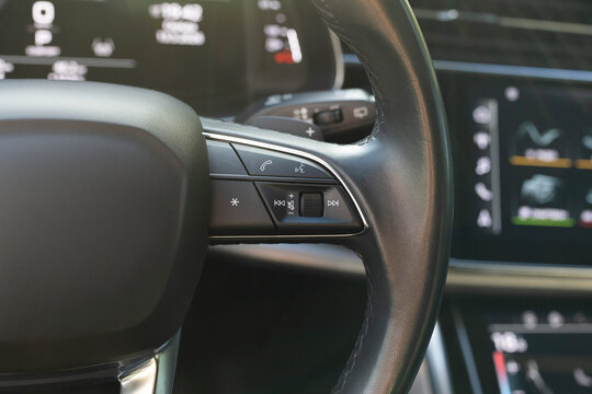Buttons on the steering wheel to accept or reject calls from the phone. Hands free and media control buttons. Volume button of car radio on steering wheel. Turns up the volume of the music