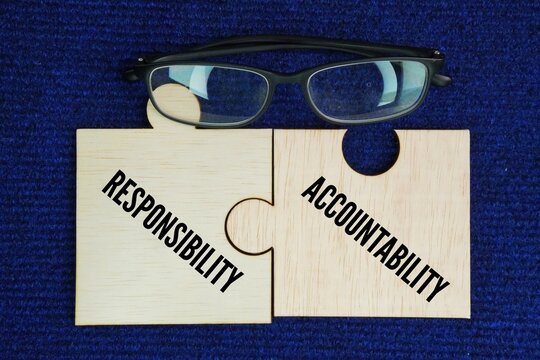 Wooden puzzle with 2 words ACCOUNTABILITY and RESPONSIBILITY. Responsibility is the obligation to complete a task or duty assigned to you. Accountability is being responsible for the final outcome.