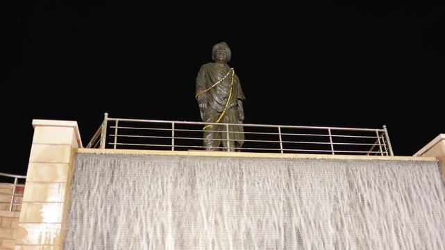 historic indian leader swami vivekananda statue above water fountain during nighttime