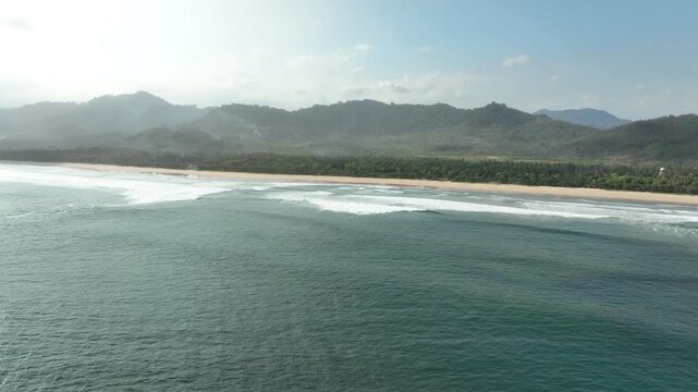 Famous Surfing Spot At Pulau Merah (Red Island) In Banyuwangi, East Java, Indonesia. Aerial Drone Shot