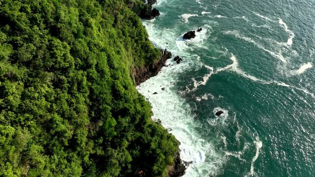 Aerial Dolly In Above Red Island Hill And Surfer Beach Paradise In East Java Indonesia