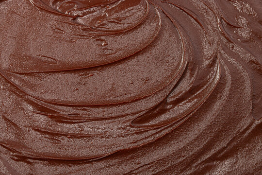 Melted dark chocolate background and texture close up.