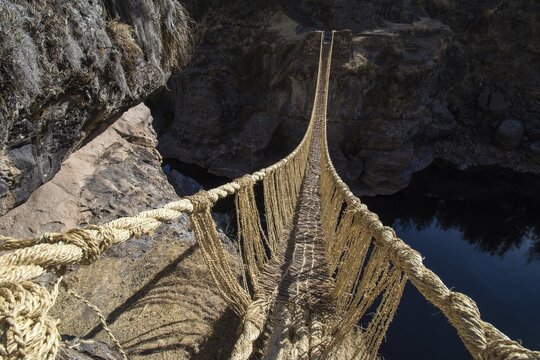 Last intact Inca rope bridge made of braided Peruvian feathergrass (Jarava ichu), across River Apurimac, Peru