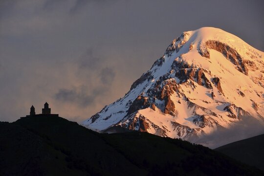 Summit of Mount Kazbek with Zminda Sameba pilgrims monastery, High Caucasus, Stepantsminda, Georgia
