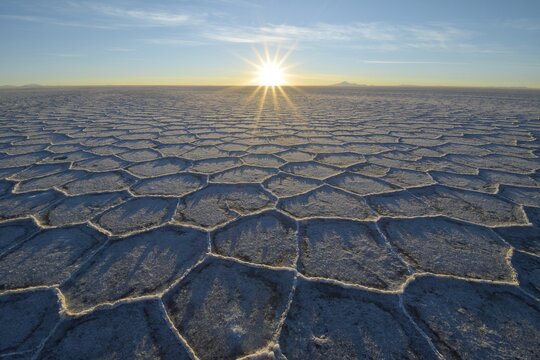 Honeycomb-structure with shadows on a salt lake at sunrise, world's largest deposits of lithium, Salar de Uyuni, Bolivia
