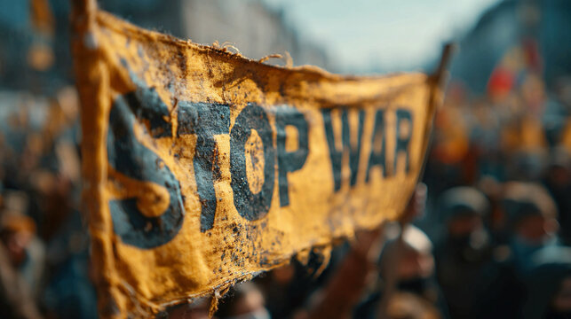 Tattered stop war banner at peaceful protest rally
