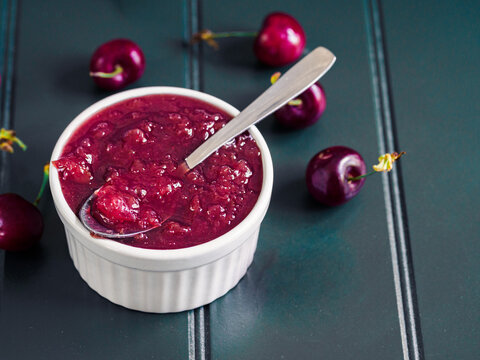 tablespoon of homemade cherry jam with a juicy texture