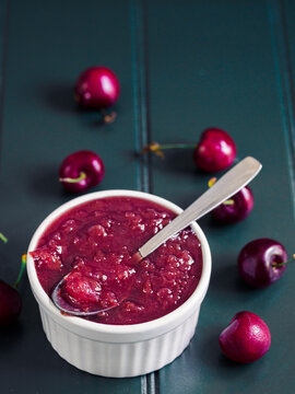 tablespoon of homemade cherry jam with a juicy texture