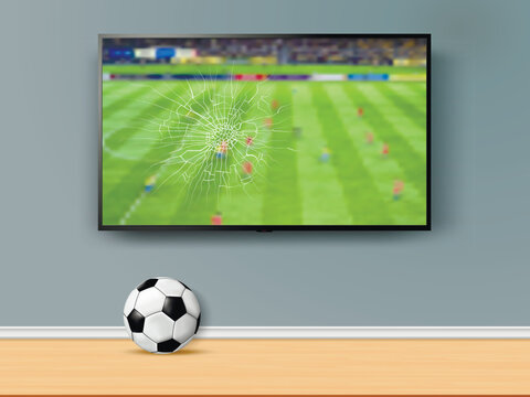 TV screen smashed by a soccer ball with a football match broadcast