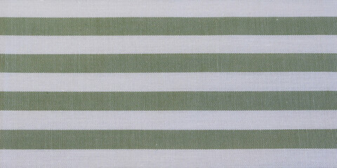 Texture of green horizontal striped cotton cloth background. Close up of classic green and white striped fabric.  © Eriko Ochiai