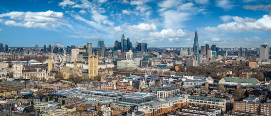 Panoramic aerial view of the skyline of London, England, with Westminster Abbey and Palace stretching back to the City<