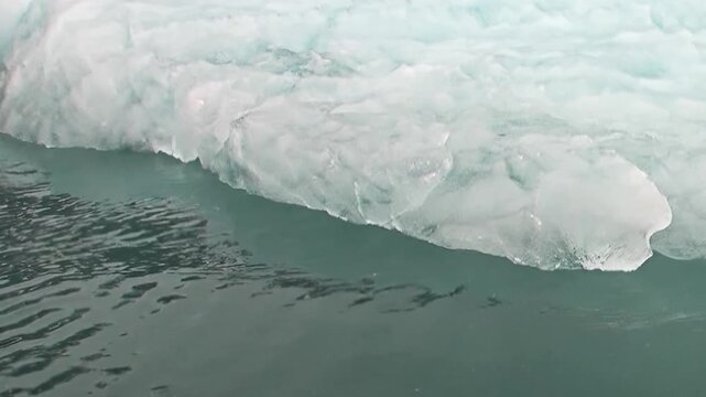 Immense glacial formations drift through the dark, restless waters of the Arctic Ocean. This extreme journey explores the frozen wilderness, highlighting the raw power and serene beauty of polar ice.