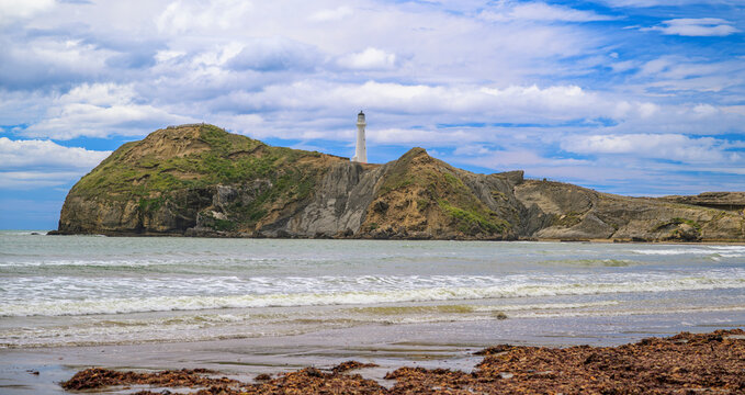 Castlepoint lighthouse on wairarapa coastline, new zealand