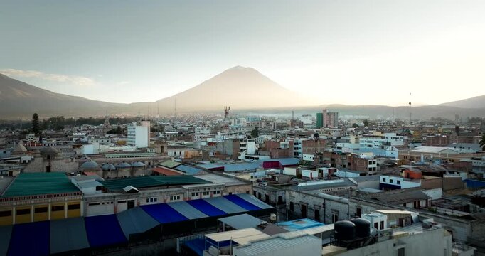 Sunrise drone view over Arequipa skyline in Peru with Misti volcano in back