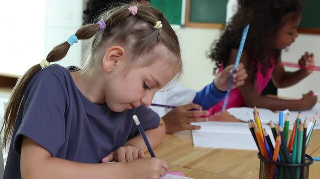 Diverse group of elementary school students learning together in classroom. Children participating in lesson, studying, and engaging in educational activities at school.Back to School 