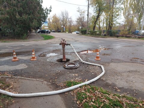 A fire standpipe installed on an underground hydrant to draw water from the water supply network. A fire standpipe is used by firefighters to connect fire hoses and fill the tanks of fire trucks with