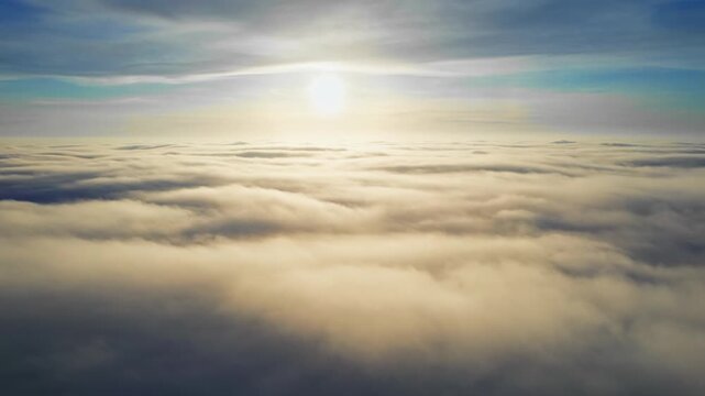Flying through a majestic skyscape at sunrise, a dynamic aerial view reveals layers of fluffy white clouds illuminated by golden light.