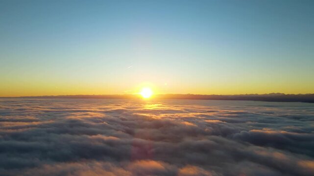 Sunrise above fog sea over Lake Constance and Alps