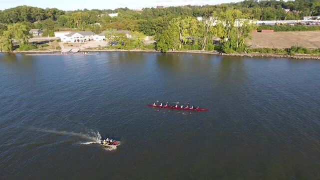 Aerial view of rowers in a shell on the Hudson River near the Hudson River Rowing Association building in Poughkeepsie, New York, United States.