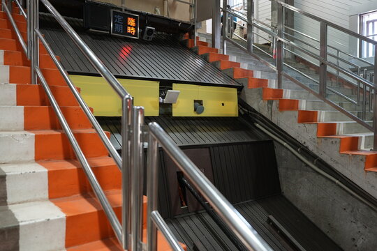 Steel cable traction system on steep funicular railway track.