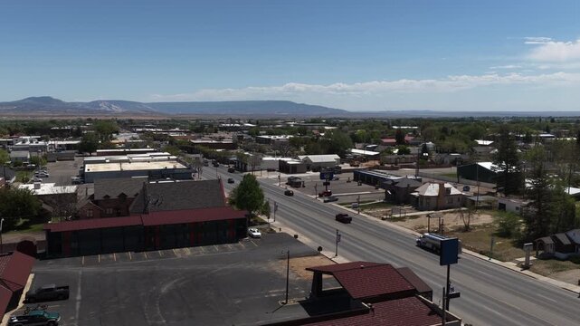 Wide aerial of US highway 191 through Vernal Utah small town in spring