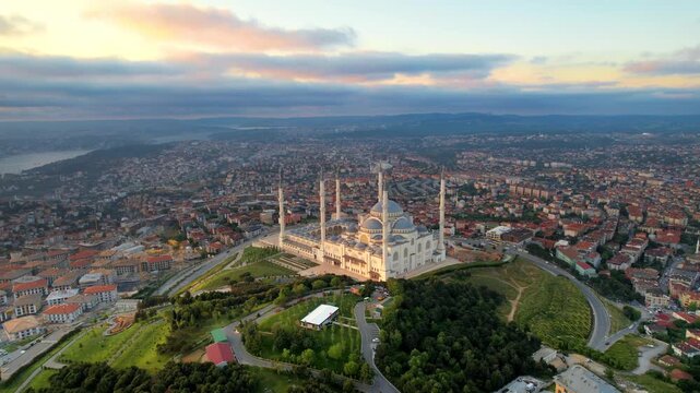 Aerial view of Camlica mosque in Istanbul Turkey during sunrise with scenic city landscape in motion.