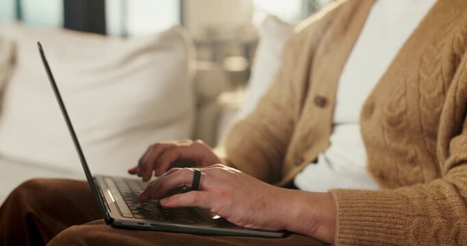 Hands, laptop and person typing on sofa in home for internet search, browsing or social media. Casual, relax and online user in living room with computer for connection, email or subscription